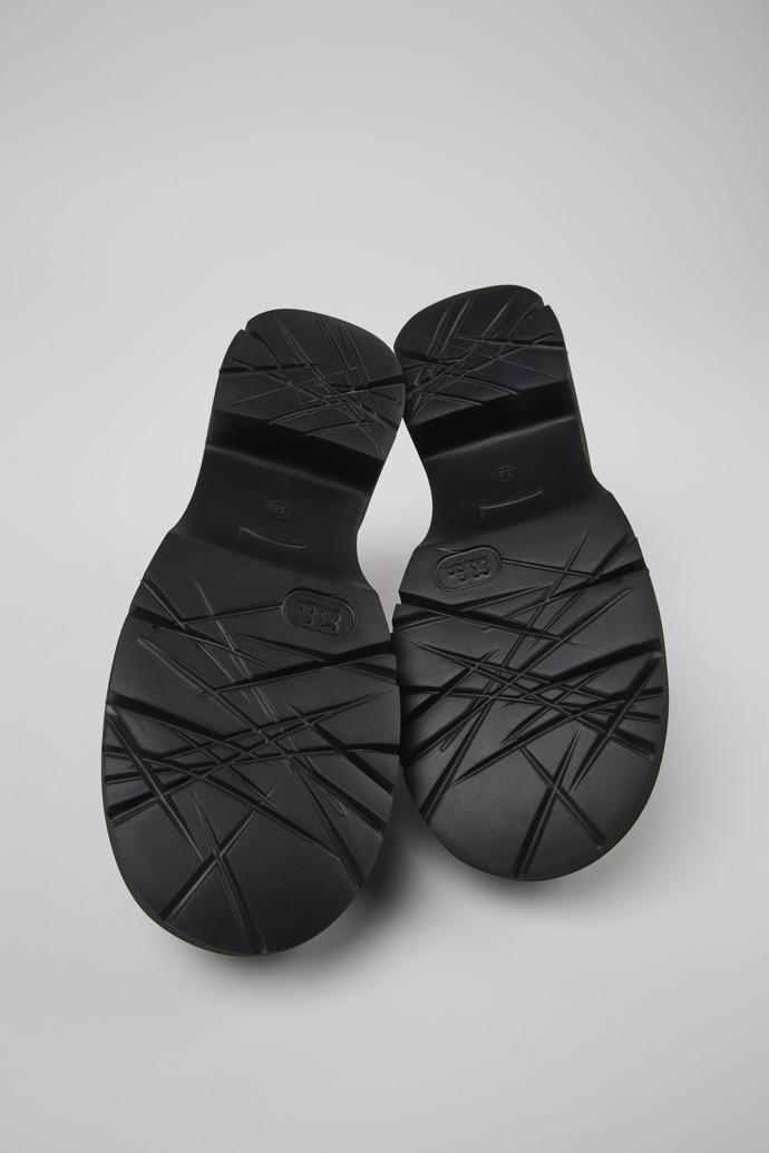 The soles of Milah Black Leather Clog for Women