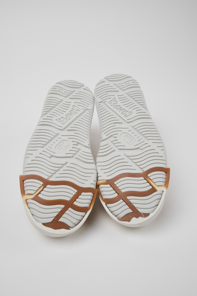 The soles of Junction Runner White Leather Women's Sneakers.