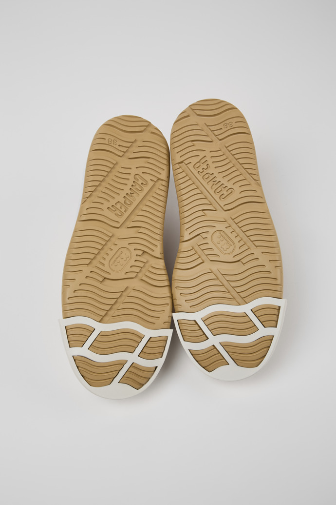The soles of Junction Runner Beige Nubuck Sneakers for Women.