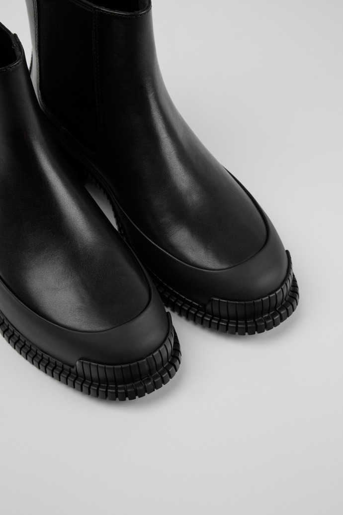 Close-up view of Pix Black Leather Ankle Boots for Women.