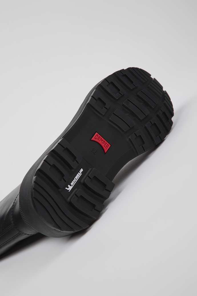 The soles of Brutus Trek Black leather boots for women